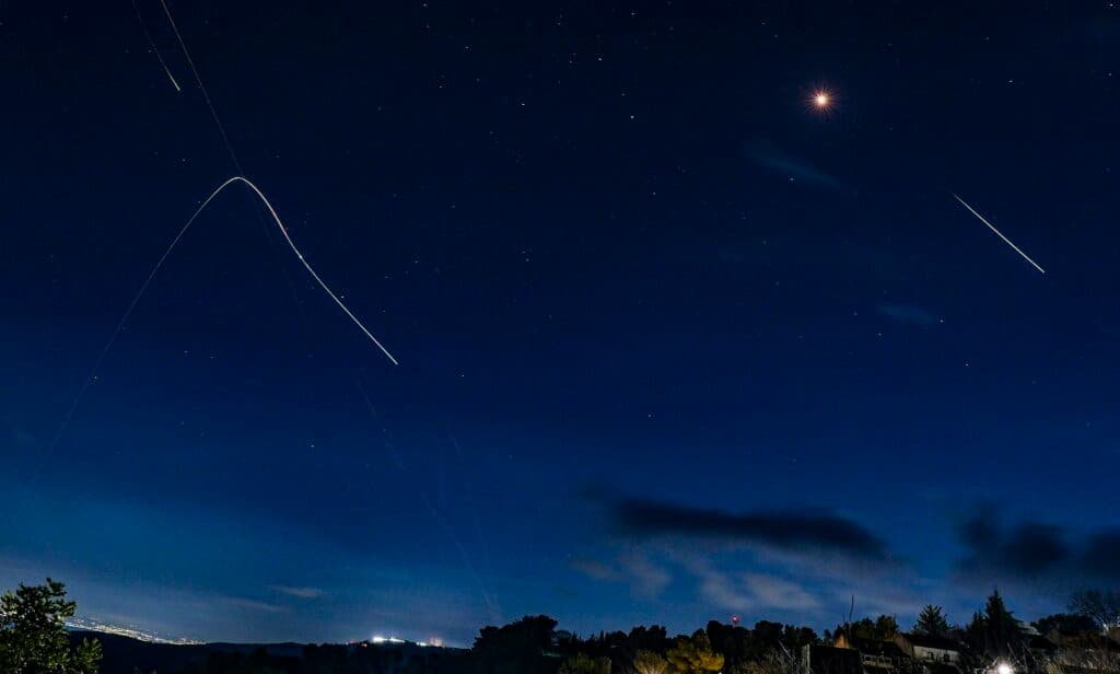 Interception missiles fired into the night sky over northern Israel