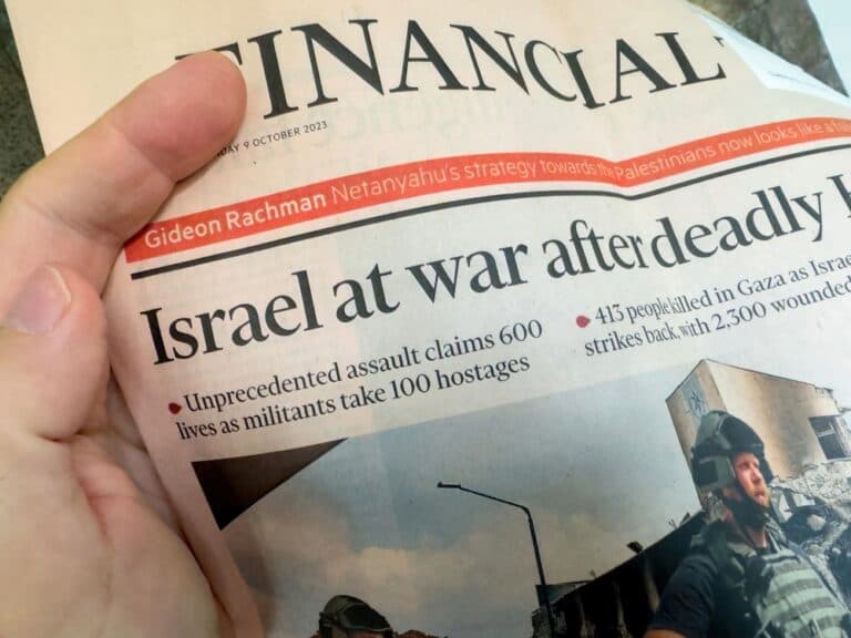 Hand on Israel News headline, October 9, 2023
