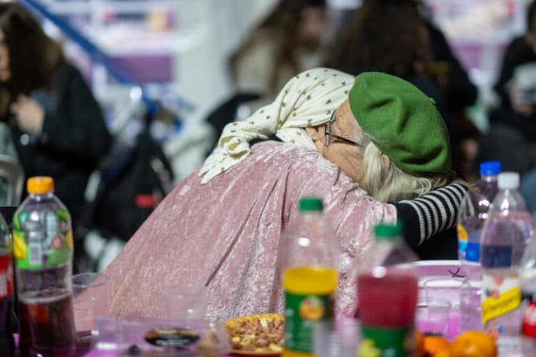 two mourners hugging at shivah