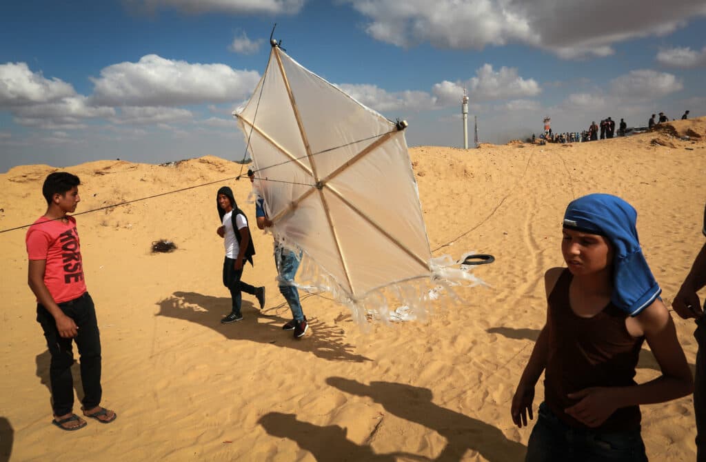 Palestinian protesters flying a kite loaded with an incendiary device near Rafah in the southern Gaza Strip.
