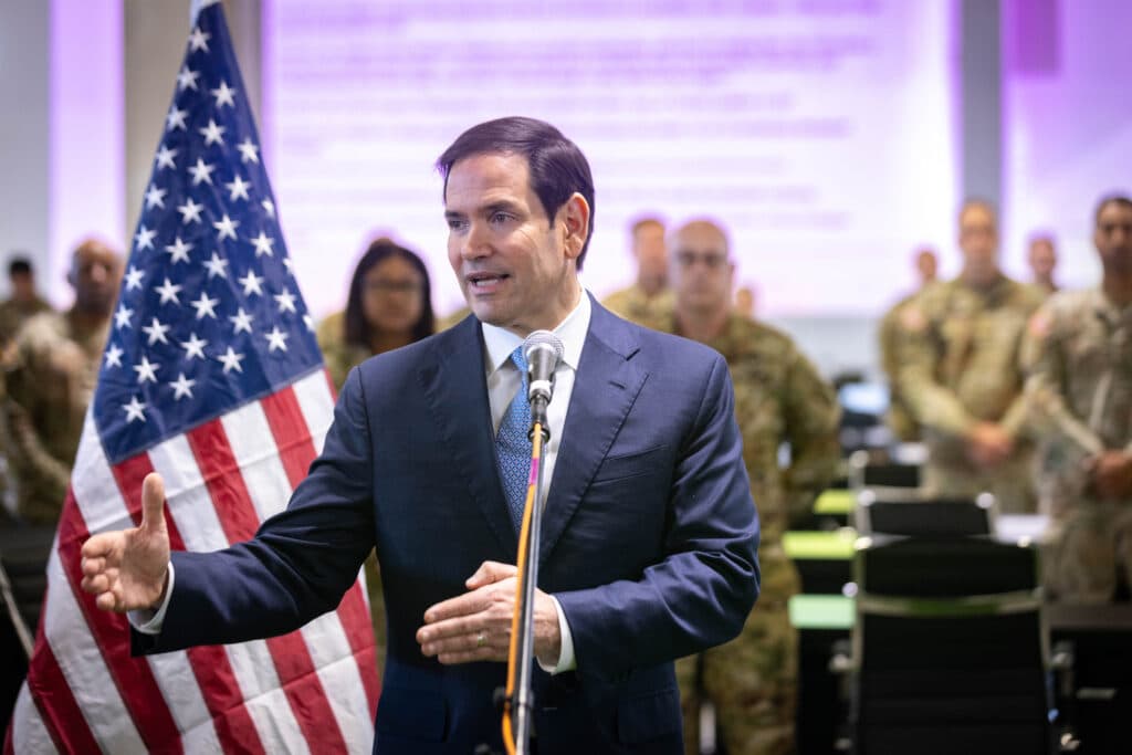 U.S. Secretary of State Marco Rubio speaking beside an American flag at a U.S. military base in Kiryat Gat.