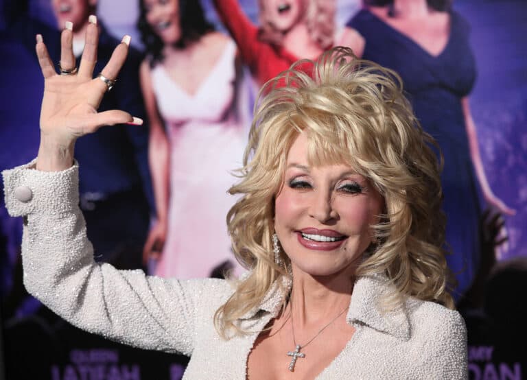 close up of Dolly parton waving
