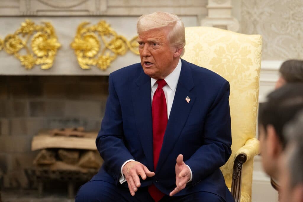 President Donald Trump speaking during a meeting in the Oval Office.