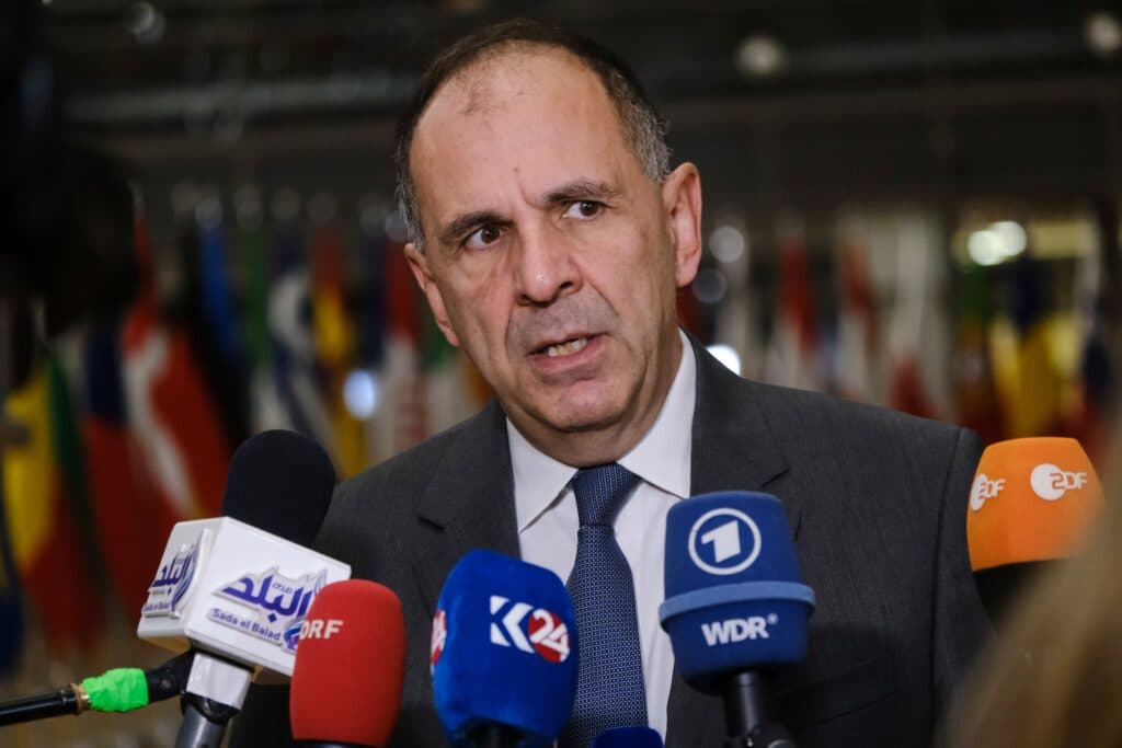 Greek Foreign Minister Giorgos Gerapetritis speaking to reporters in Brussels.