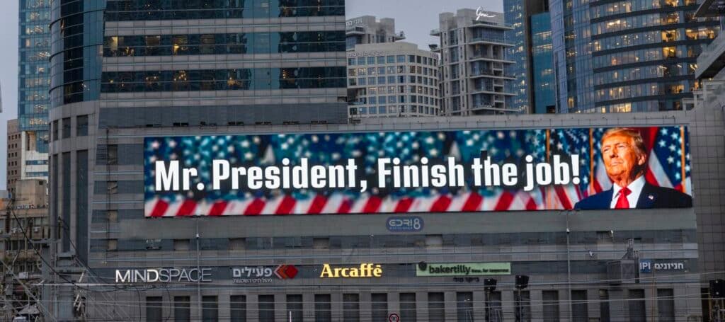 A billboard in Tel Aviv showing Donald Trump with the message “Mr. President, Finish the job!”