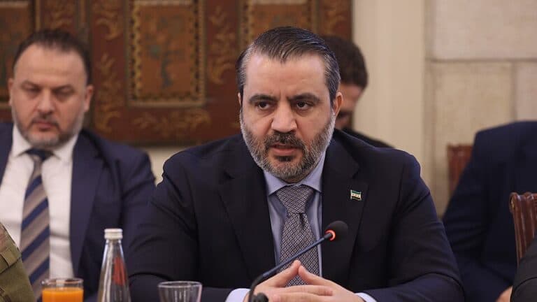 Syrian Foreign Minister Asaad al-Shaibani speaking at a meeting.