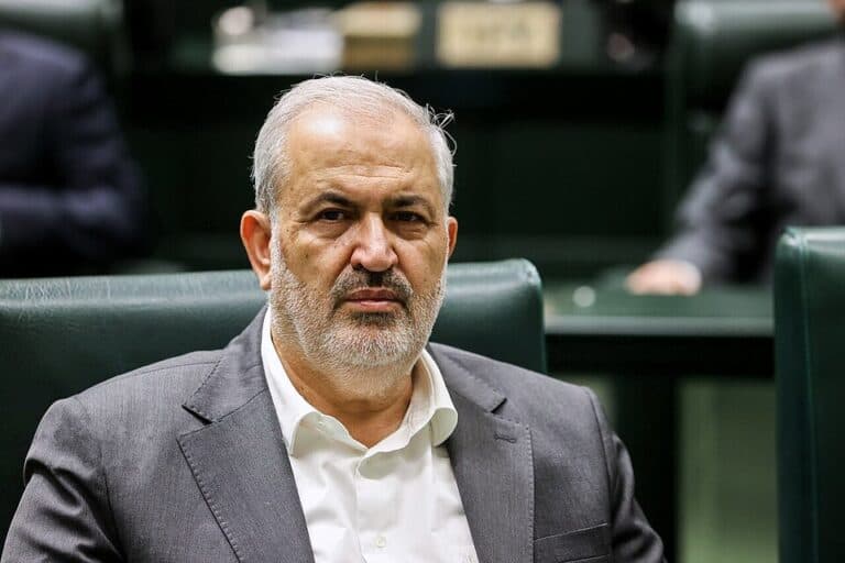 Iranian Energy Minister Abbas Aliabadi seated inside the Iranian parliament.
