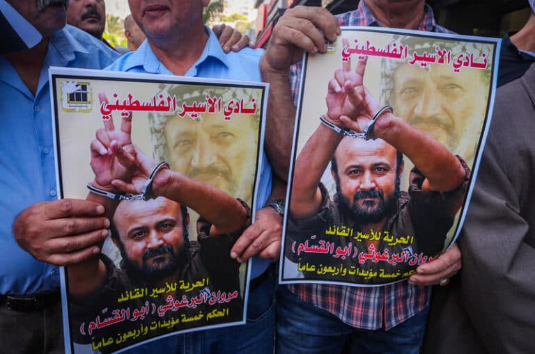 protest signs with picture of Marwan Barghouti