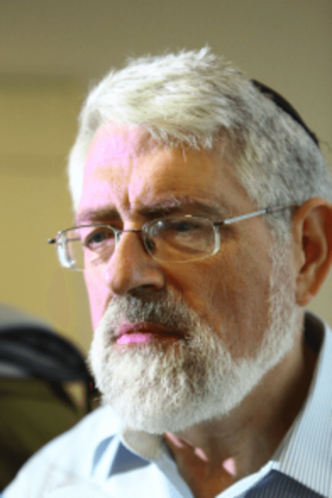 Prof. Haim Sompolinsky looks toward the camera in a close-up portrait.