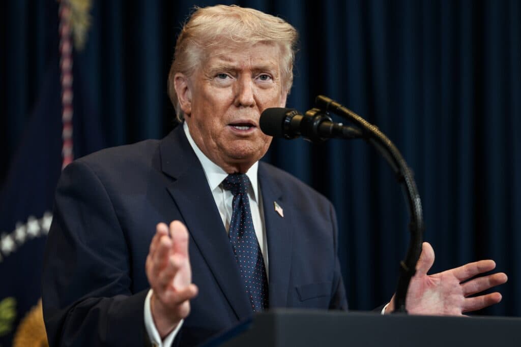 A U.S. president speaking into a microphone at a podium.