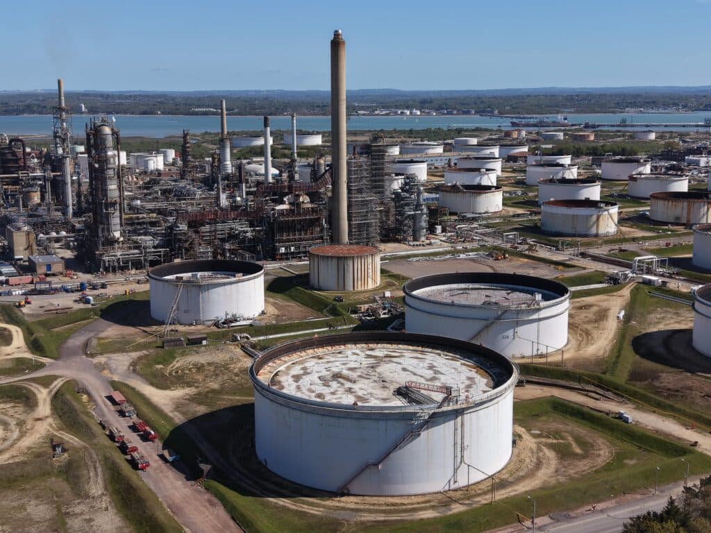 An industrial energy facility with storage tanks and refinery infrastructure.