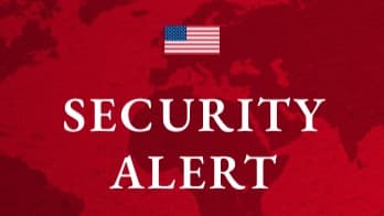 U.S. security alert graphic featuring an American flag above the words “Security Alert.”