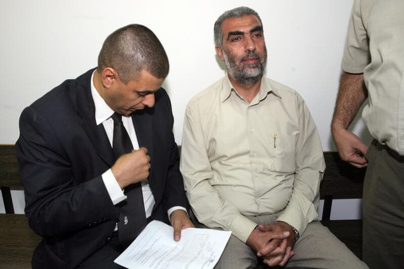 Kamal Khatib sits in court beside his attorney at the Jerusalem Magistrate’s Court.