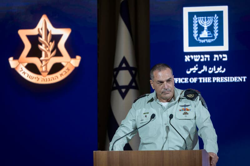 IDF Chief of Staff Eyal Zamir speaks at a podium during a ceremony at the President’s Residence in Jerusalem.