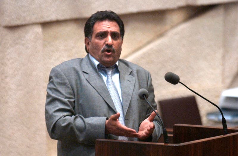 Former Knesset member Azmi Bishara speaks from the Knesset podium in Jerusalem.