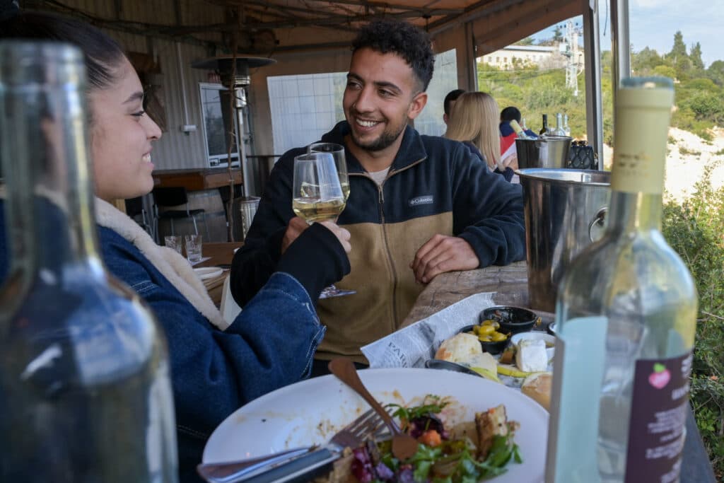 israeli couple at a restaurant, sitting