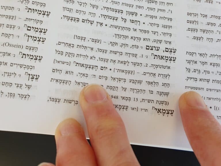 hebrew text with fingers