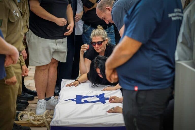 Family members mourn during the funeral of Sgt. Rotem Yanai.