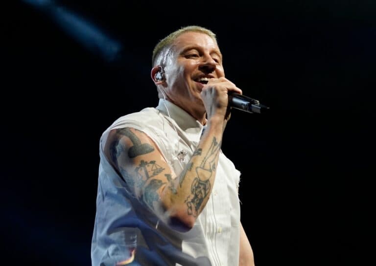 Macklemore on stage with microphone, London, UK