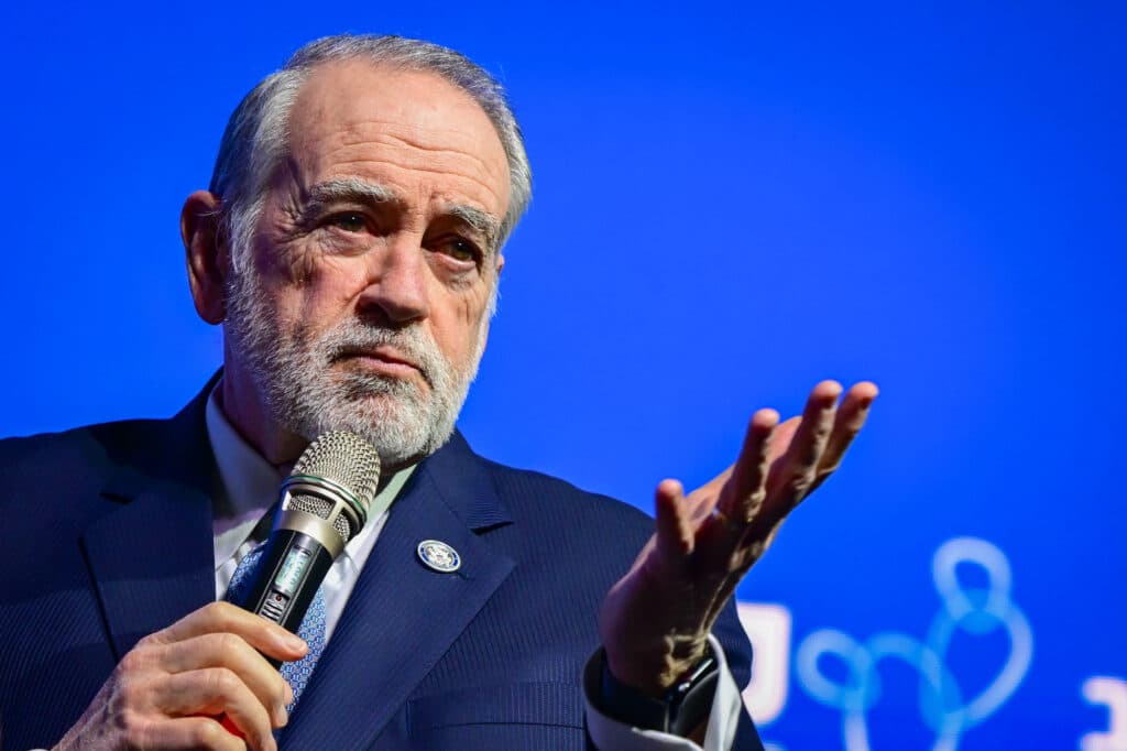 U.S. Ambassador to Israel Mike Huckabee speaks into a microphone during a conference at Tel Aviv University.
