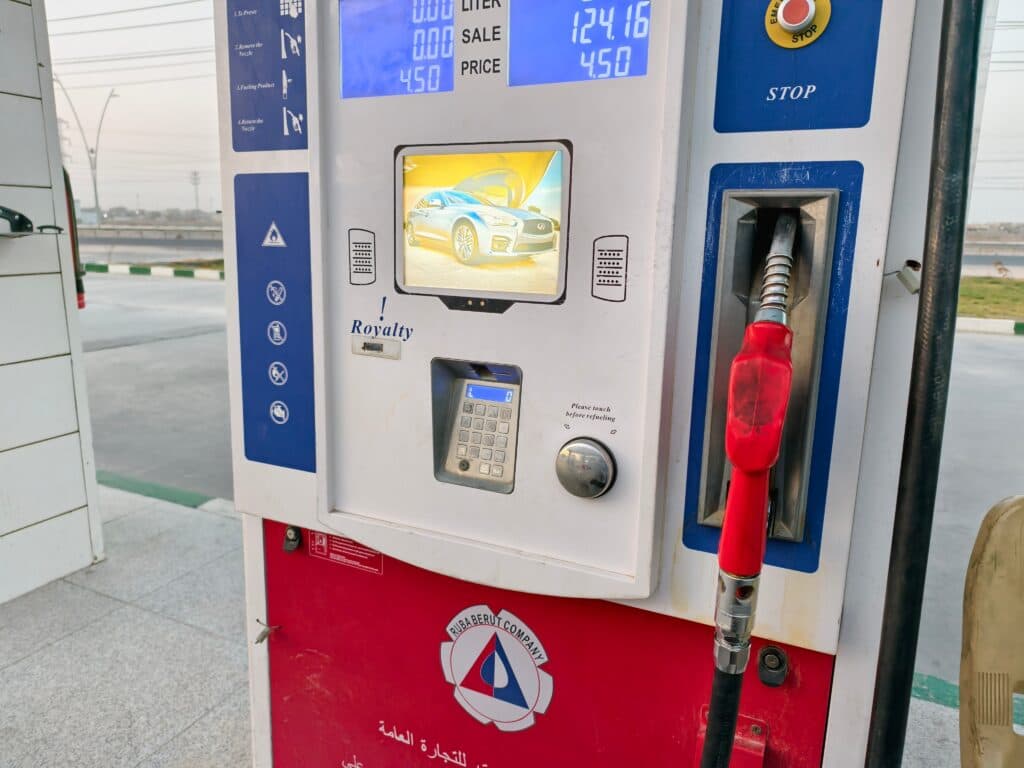 A modern gas pump with a digital display at a gas station in Basra, Iraq.